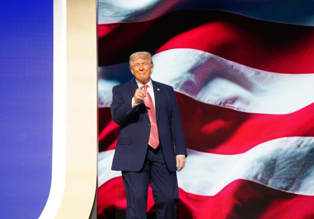 MIAMI BEACH, FLORIDA - MARCH 27: U.S. President Donald Trump greets the crowd before speak