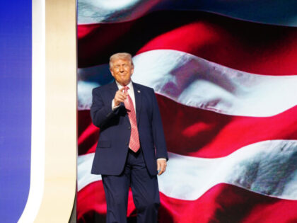 MIAMI BEACH, FLORIDA - MARCH 27: U.S. President Donald Trump greets the crowd before speak