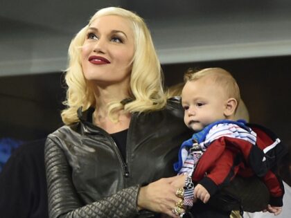 Gwen Stefani and Apollo Bowie Rossdale attend day 11 of the 2014 US Open at USTA Billie Je