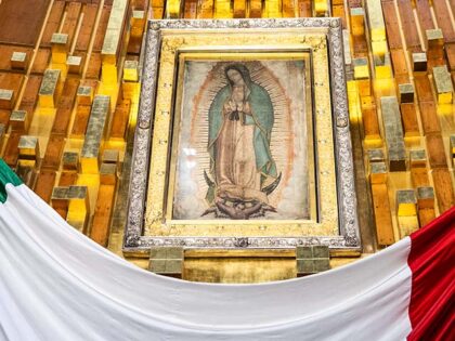 The original tilma of Juan Diego hangs above the high altar of the Guadalupe Basilica on D