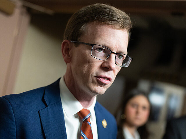 Rep. Dusty Johnson, R-S.D., talks with reporters after a meeting of the House Republican C