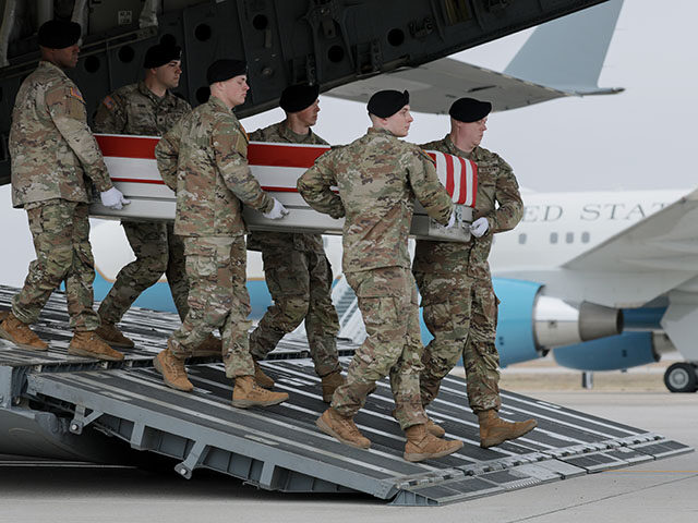 GettyImages2265340687 A U.S. Army carry team moves a flag-draped transfer case containing the remains of Chief W