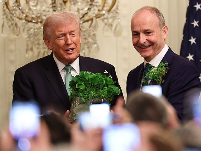 U.S. President Donald Trump receives a bowl of shamrocks from Taoiseach of Ireland Micheá