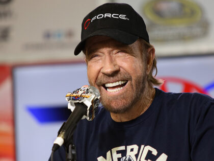 Actor Chuck Norris speaks with the media during a press conference prior to the NASCAR Spr