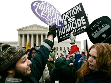 Pro-life activist Jessica Meunier (R) of Fitchburg, MA, and pro-abortion activist Luqman C
