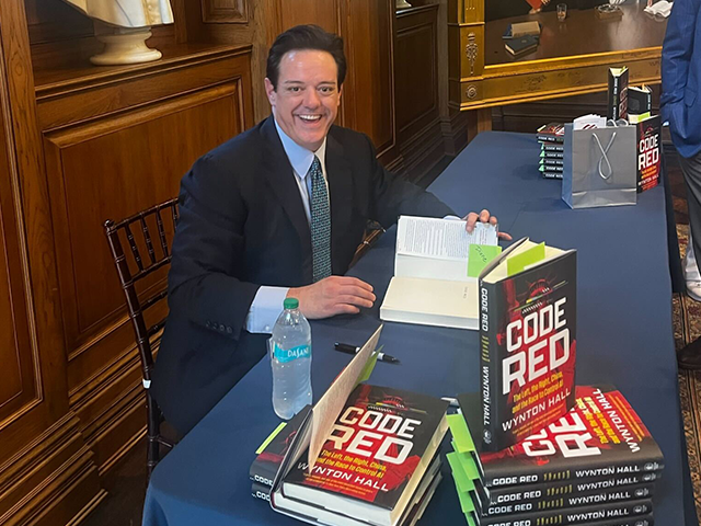 Wynton Hall signing "Code Red"
