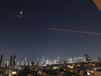 Rocket trails are seen in the sky amid a fresh barrage of Iranian missile attacks above th