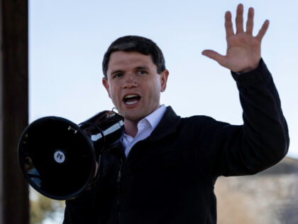 Supporters of Texas Senate candidate James Talarico (D-TX) cheer when seeing early results