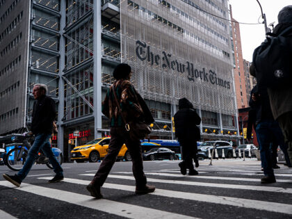 NEW YORK, NEW YORK - JANUARY 14: People walk past The New York Times Building, a 52-story