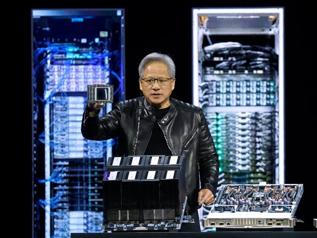 Jensen Huang holding AI chip