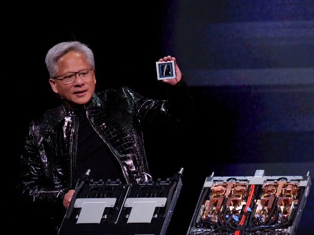 Jensen Huang holding Nvidia AI chips