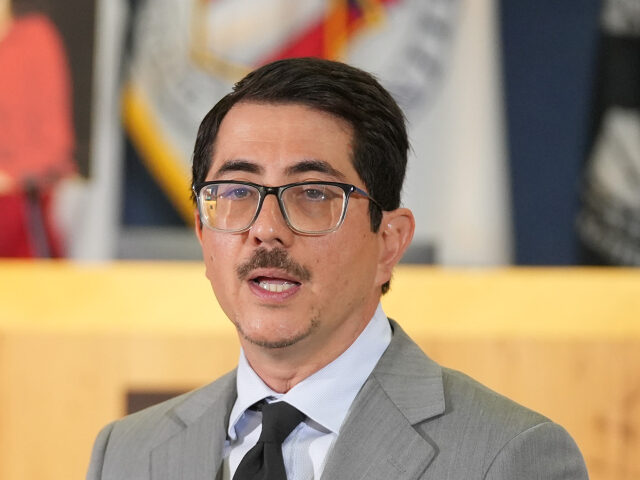 Travis County District Attorney Jose Garza speaks at a news conference at Austin City Hall
