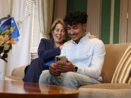 Boston, MA - June 13: Governor Maura Healey places her hands on Marcelo Gomes da Silva