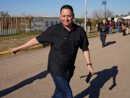 Rep. Tony Gonzales, R-Texas, walks near other members of Congress near the Texas-Mexico bo