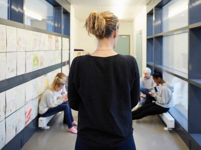 Teacher in hallway of school