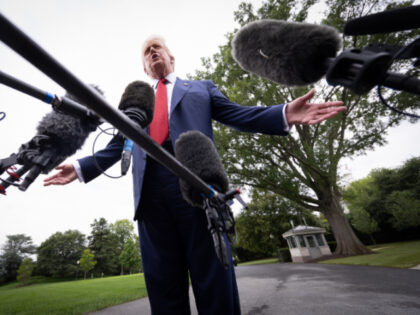 U.S. President Donald Trump speaks to the media as he departs the White House on August 01