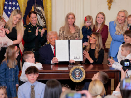 U.S. President Donald Trump signs a proclamation for Women's History Month with first
