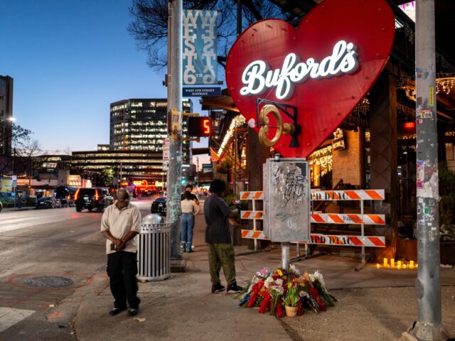 austin shooting AUSTIN, TEXAS - MARCH 02: People pay homage to the shooting victims at a makeshift memoria