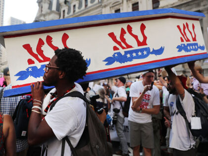 PHILADELPHIA, PA - JULY 26: Black Lives Matter protesters hold a wooden coffin with an ups