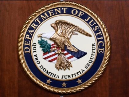 FILE - The seal of the Dept of Justice is shown on the podium, Aug. 1, 2023, at an office