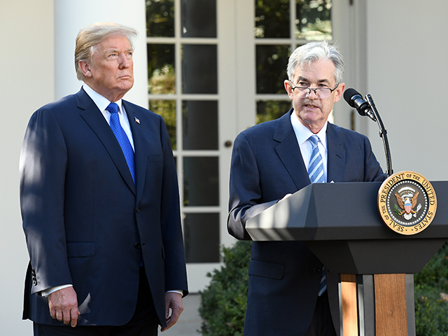 President Donald Trump listens as Jerome Powell speaks in the White House Rose Garden on N