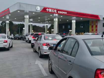 Vehicles queue to refuel at a gas station on March 9, 2026 in Nanchang, Jiangxi Province o