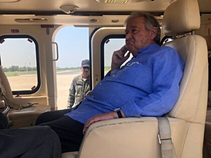 United Nations Secretary-General Antonio Guterres sits in a helicopter during his visit to