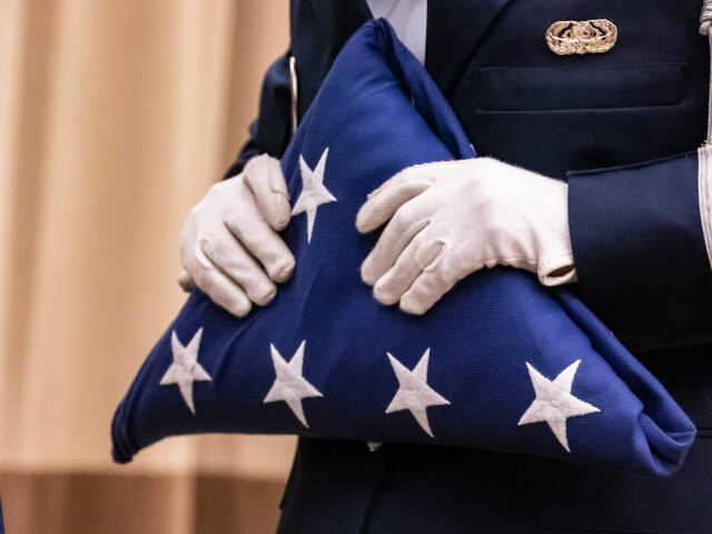 honor guard with folded American flag flag