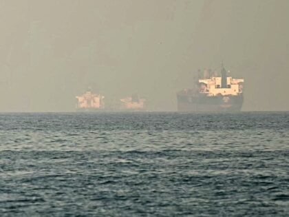 Cargo ships and tankers are seen off coast city of Fujairah, in the Strait of Hormuz in th