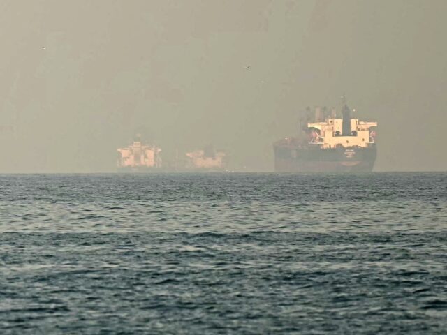 Cargo ships and tankers are seen off coast city of Fujairah, in the Strait of Hormuz in th