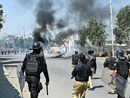 Police fire tear gas at Shiite Muslims as they stage protests in solidarity with Iran, out
