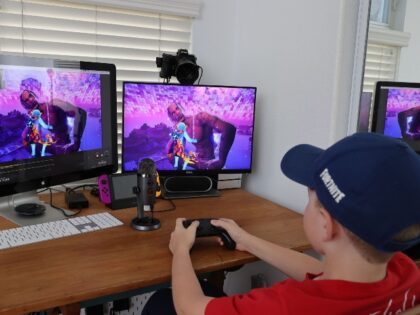 kid playing Fortnite