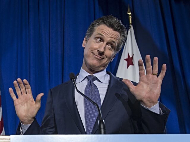 Gavin Newsom, Democratic candidate for governor of California, reacts as his wife Jennifer