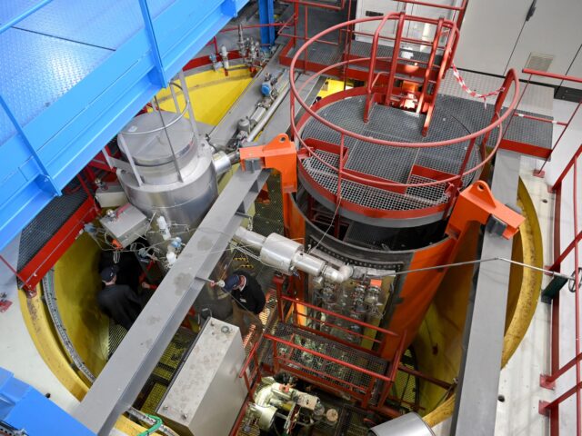 Engineers walk in the Exocet installation of the Poseidon departement during a press visit