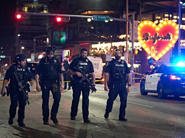 AUSTIN, TEXAS - MARCH 1: Austin police work at the scene of a shooting on West 6th Street