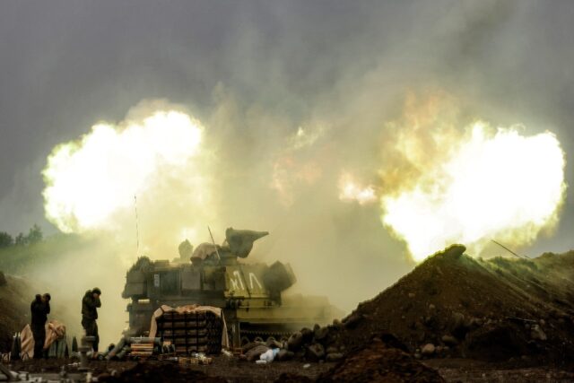 An Israeli howitzer fires rounds towards southern Lebanon