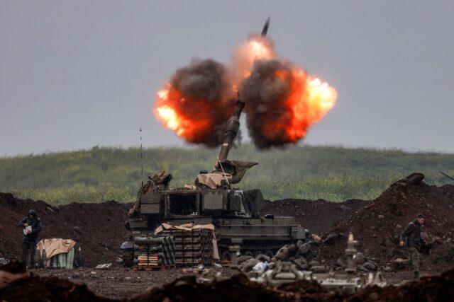 An Israeli howitzer fires rounds towards southern Lebanon from a position in the upper Gal