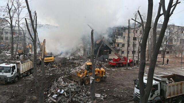 A ballistic missile strike destroyed a five-storey apartment block in Kharkiv, killing nin