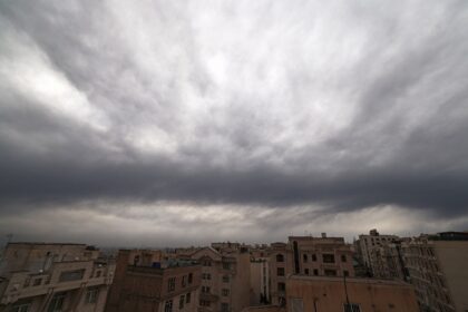 Cloud and smoke lay heavy over Tehran on Sunday after overnight US-Israeli strikes on fuel