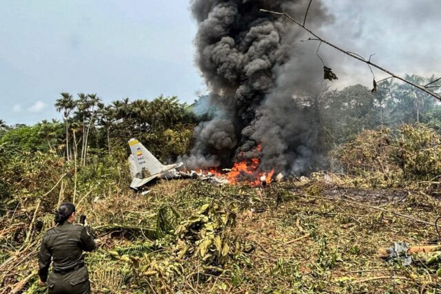 Flames and thick black smoke rise from an Air Force Hercules that crashed during takeoff i