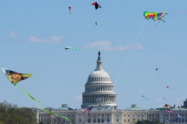 Kites fly during the Cherry Blossom Kite Festival on the National Mall in Washington, wher