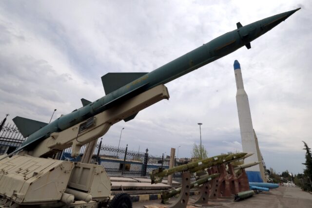 Mockups of Iranian-made missiles are displayed at an exhibition outside the Defence Museum