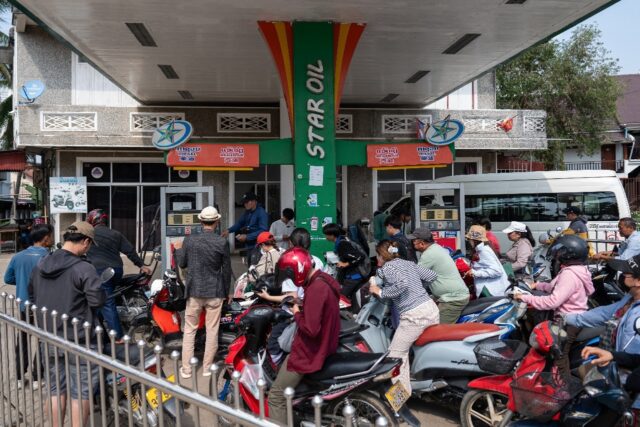 Motorists queue at a petrol station in Luang Prabang, Laos, following import disruptions c