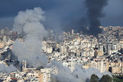 Plumes of smoke rise from the sites of Israeli airstrikes on the southern suburbs of Beiru