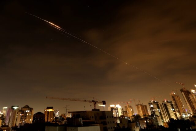 Rocket trails seen in the sky above the Israeli coastal city of Netanya early on Monday