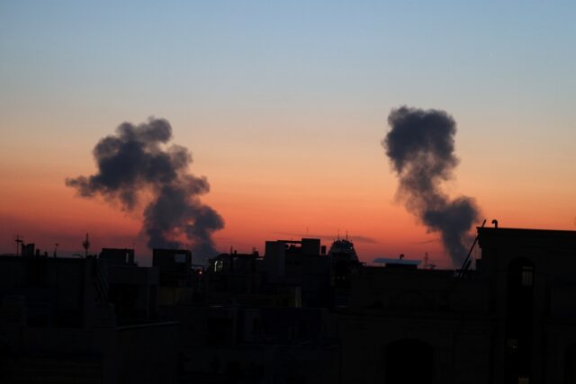 Smoke rises from the site of air strikes in the Iranian capital