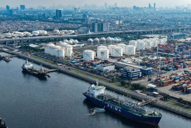 Tankers and cargo ships at the oil depot and container terminal of the Tanjung Priok Port