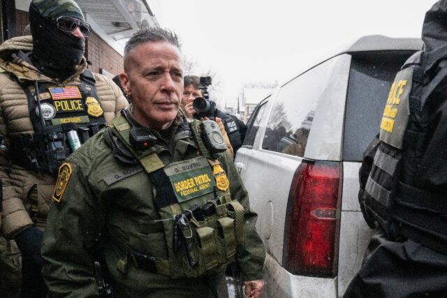 US Border Patrol commander Gregory Bovino walks to his vehicle at a gas station in Minneap