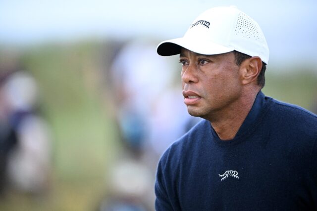 US golfer Tiger Woods reacts after driving from the 4th tee during his second round, on da