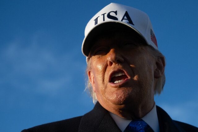 US President Donald Trump speaks to reporters before boarding Air Force One as he departs